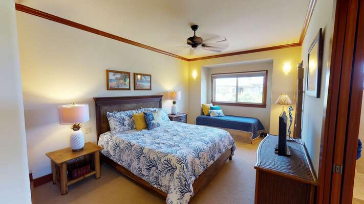 Bedroom with Two Beds, TV, Dresser, and Ceiling Fan