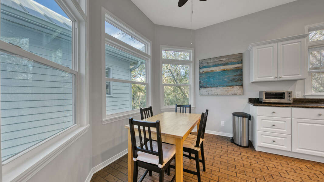 Well equipped kitchen with stainless appliances and breakfast nook with seating for 4.