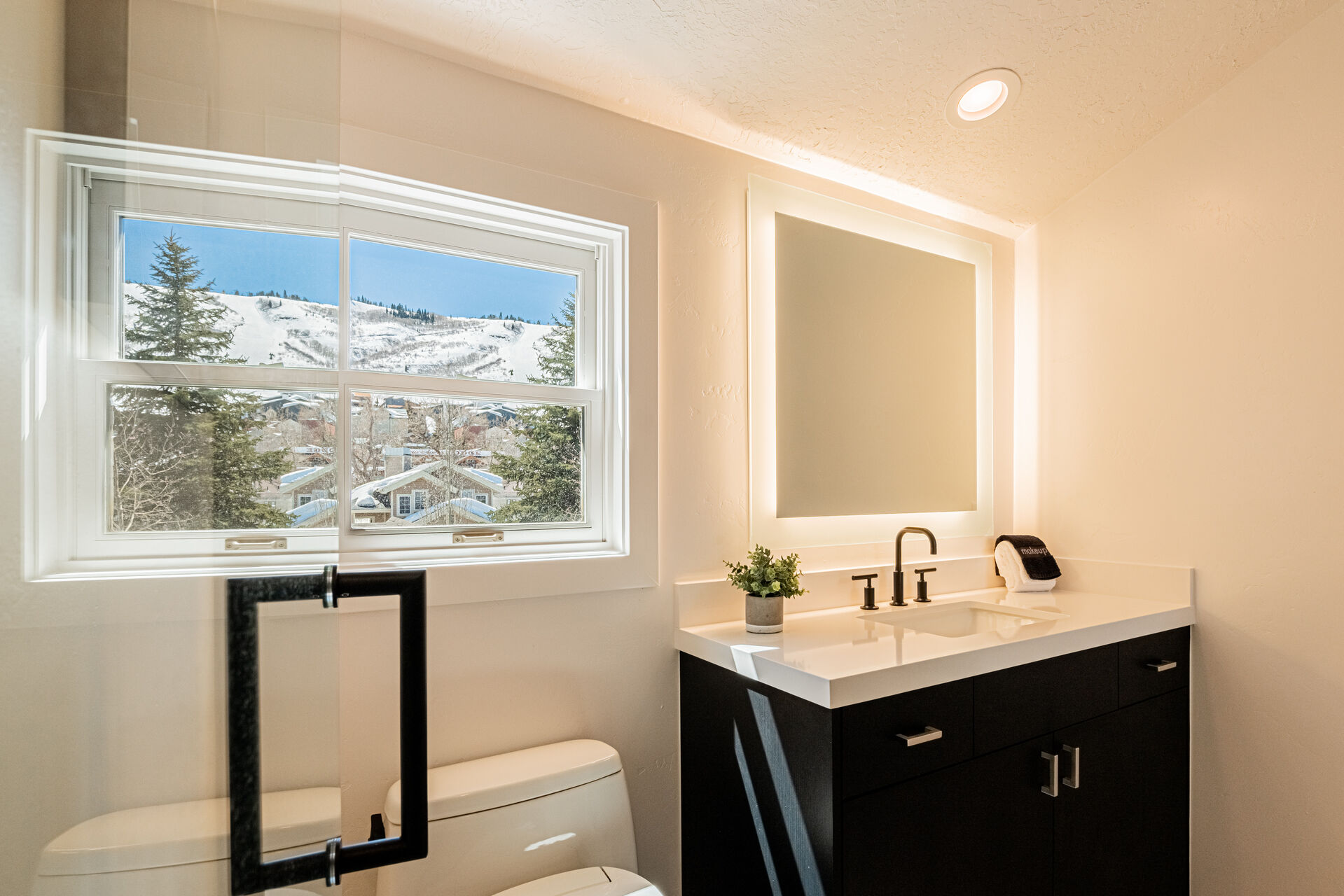 Upper Level Shared Full Bath 2 a Lighted Mirror and Mountain Views