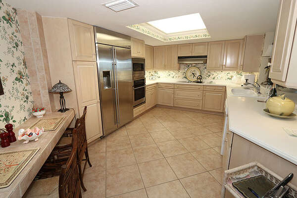 Sizable kitchen with gigantic refrigerator