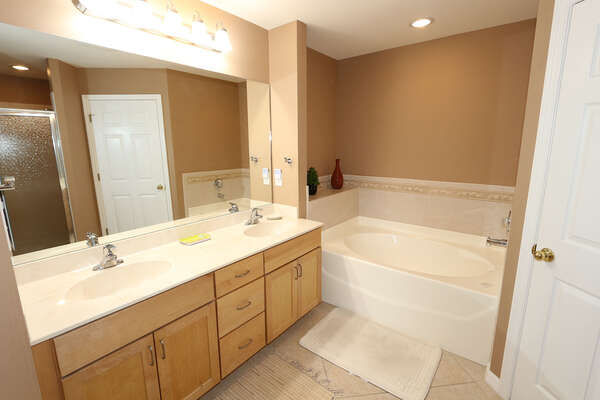 Master bathroom with soaking tub, walk in shower and double sinks