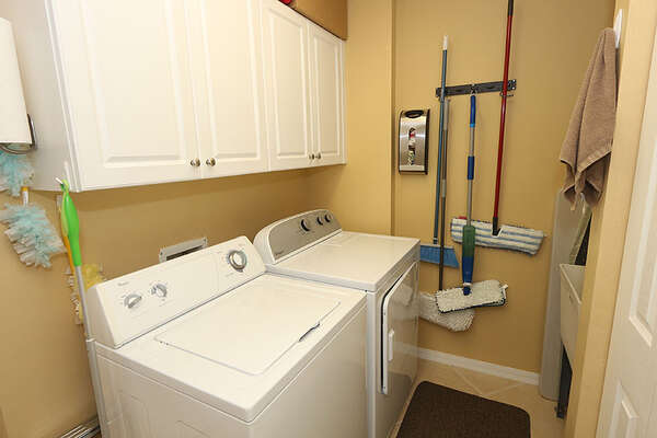 Private laundry room with washer and dryer