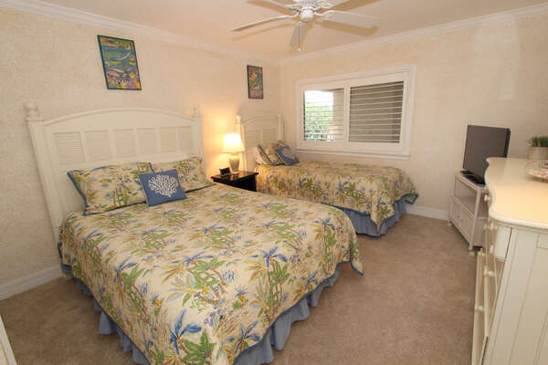 Guest bedroom offers lots of room and comfortable beds.