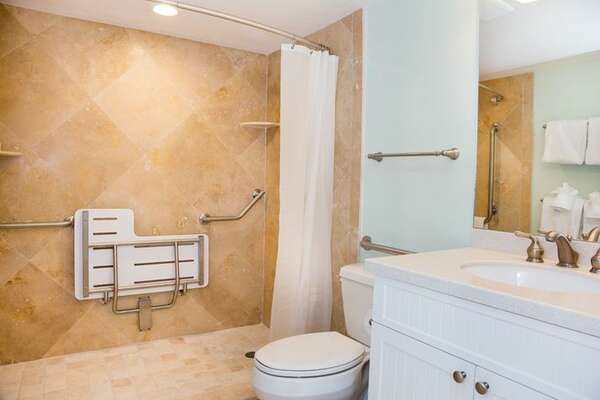 Master Bathroom with open shower, seat and grab bars