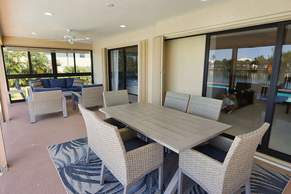 Lanai with outdoor dining table and seating