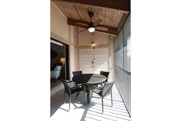 Screened lanai with outdoor dining table