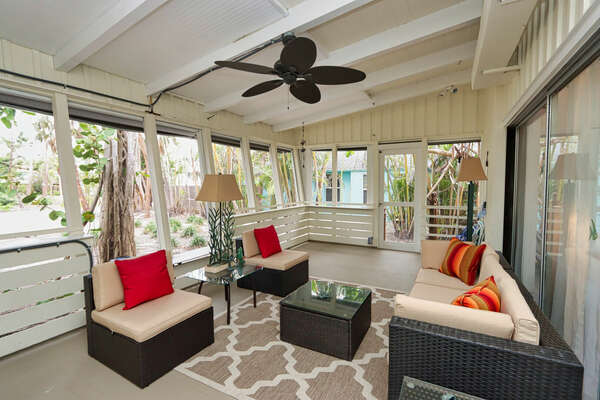Screened-in lanai with outdoor seating