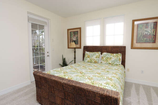Second-floor guest bedroom with (1) queen bed