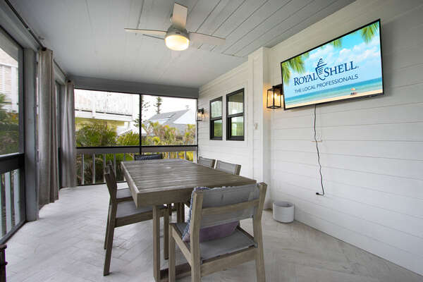 Screened lanai with outdoor dining table