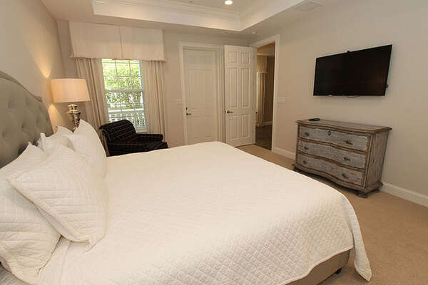 Large guest bedroom with walk-out porch