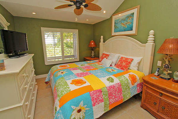 Master bedroom is colorful and comfortable.
