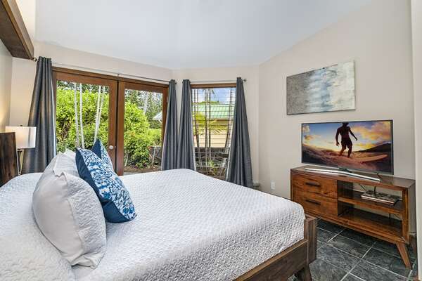 Bedroom with Large Bed, Smart TV, and Private Lanai