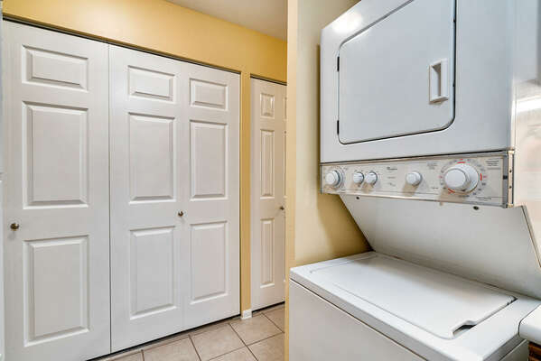 Laundry area with stacked washer/dryer