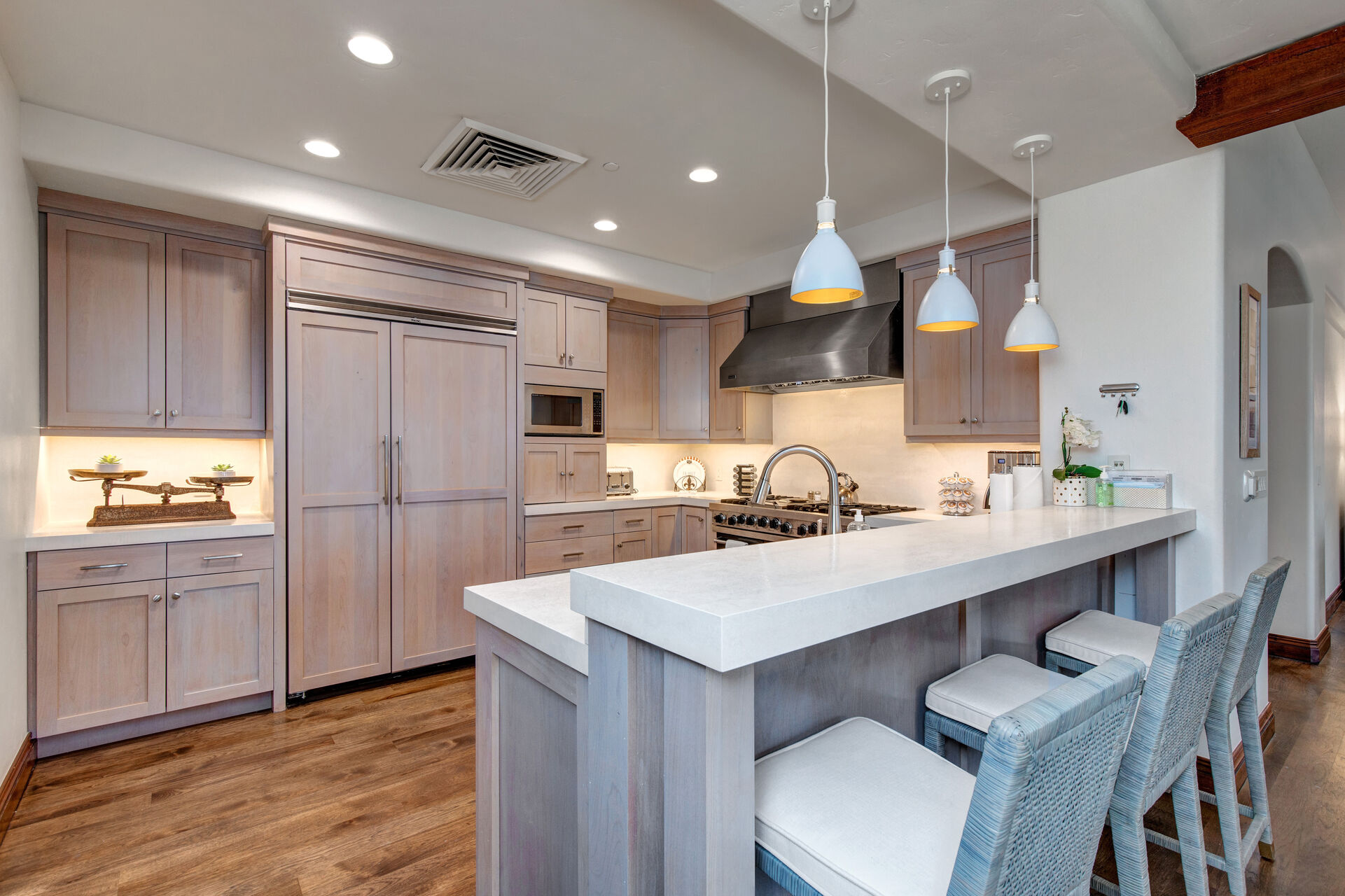 Gourmet Kitchen with High-end Appliances, Stone Counters and Bar Seating for Three
