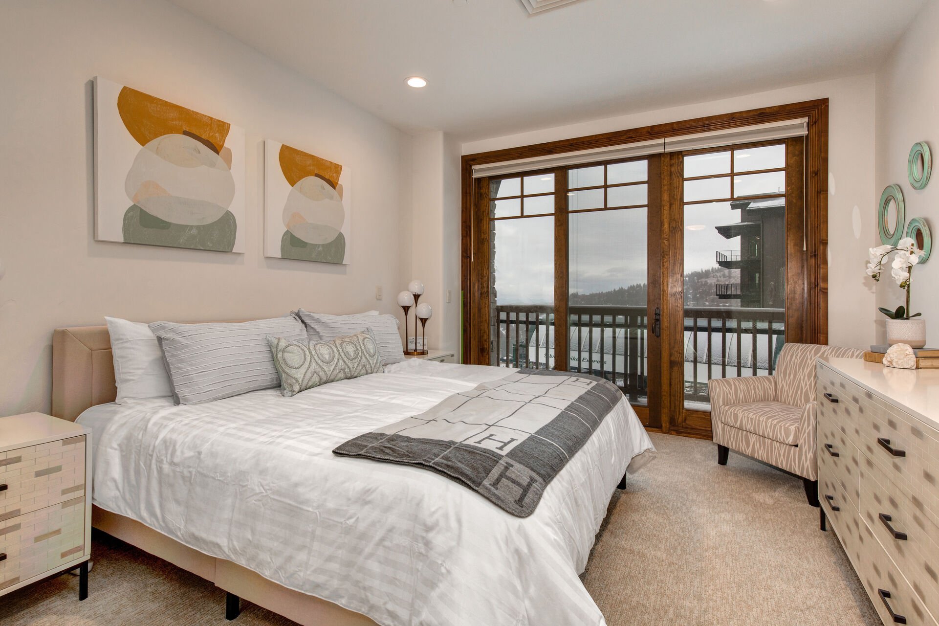 Master Bedroom 2 with a King Bed, Smart TV, and Balcony Overlooking Silver Buck Ski Run