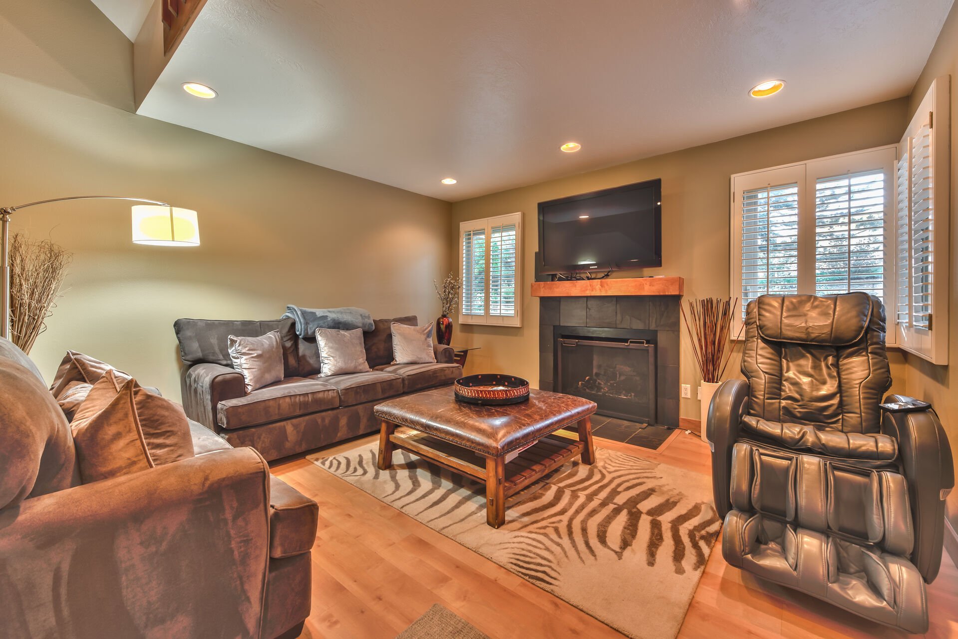 Living Room with Comfortable Furnishings, a Massage Chair, a Gas Fireplace and a 50