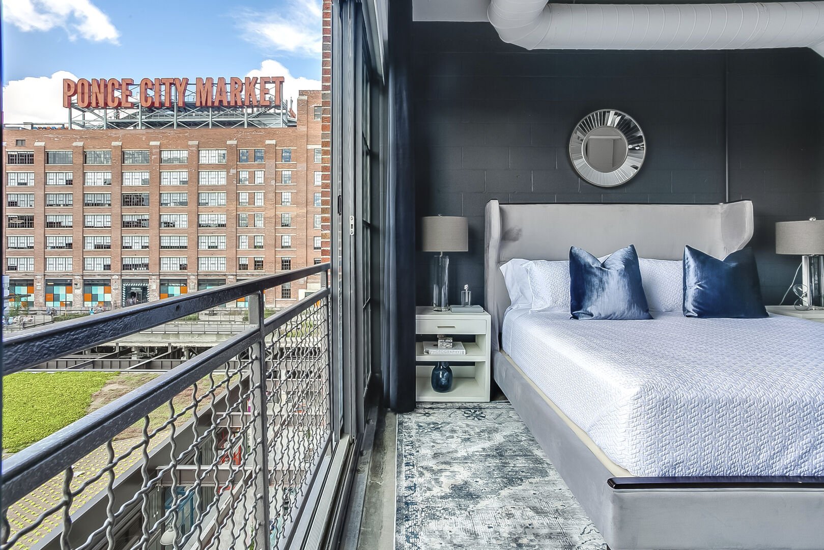 The large bed and nightstands of the Sleeping area of this Apartment Near Ponce City Market.