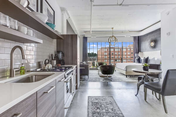 The kitchen of this Ponce City Flat with seating for two.