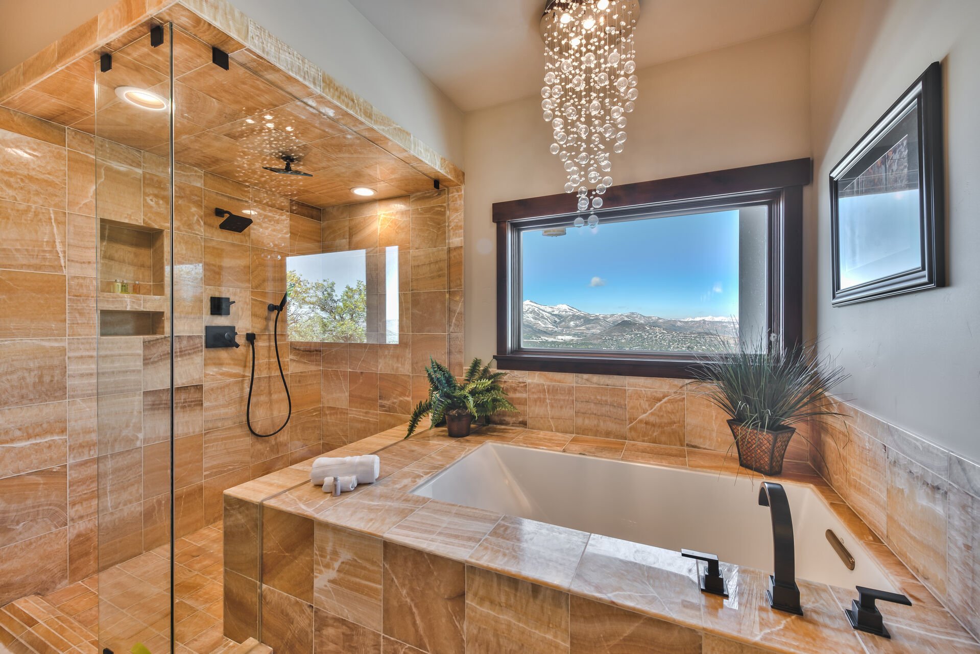 Grand Master Bath with a Soaking Tub and a Large Tile Shower with Triple Shower Heads