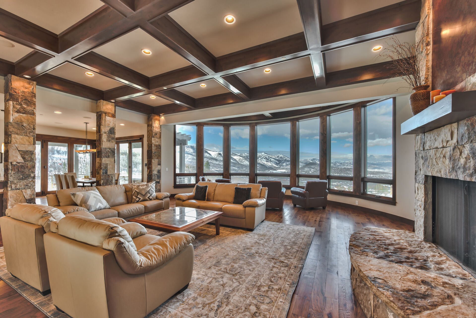 Main Level Living Room with Leather Seating, a Warm Gas Fireplace and Additional Sitting Area to Soak in the Views