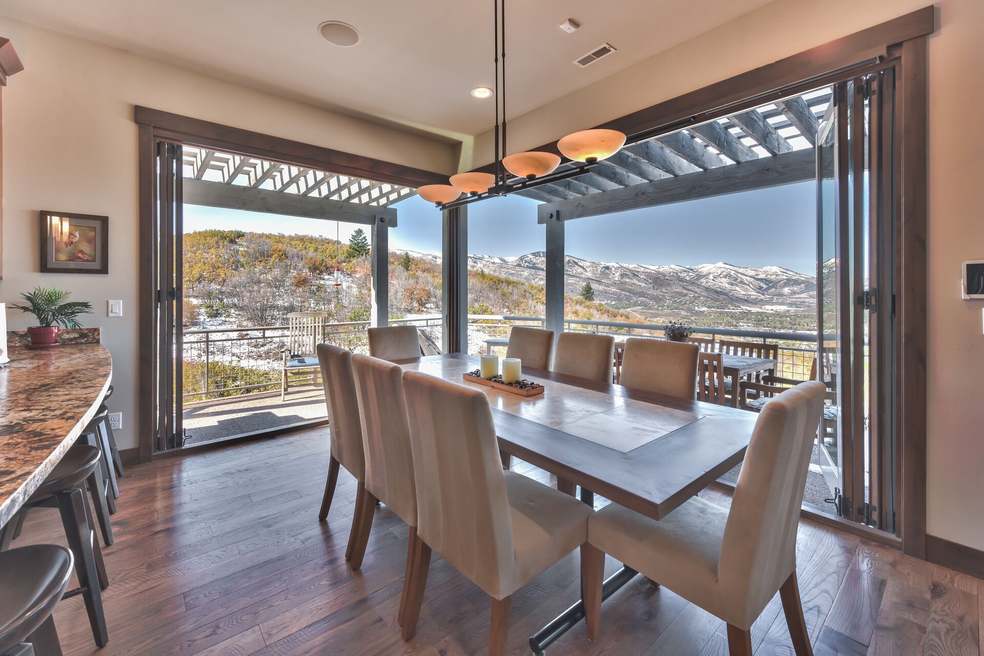 Dining Area with Slider Doors that Open Completely to the Private Deck with Patio Dining Table, a Gas BBQ Grill and Amazing Views!