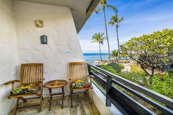 Lanai with seatings for two at this Kona oceanfront rental.