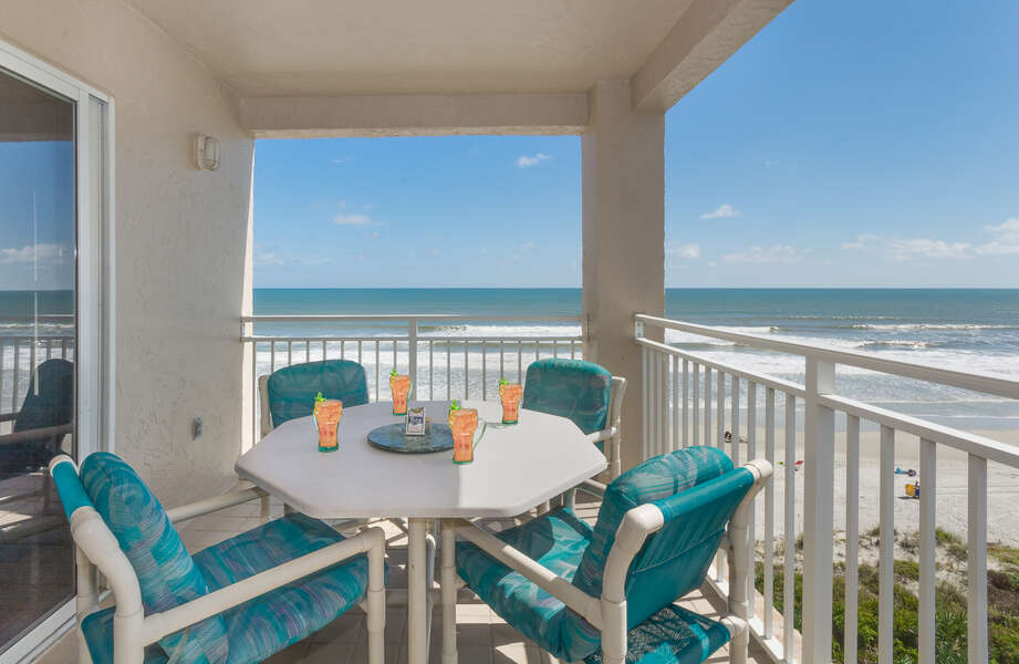 Dine al fresco with seating fro 4 on the oceanfront balcony.