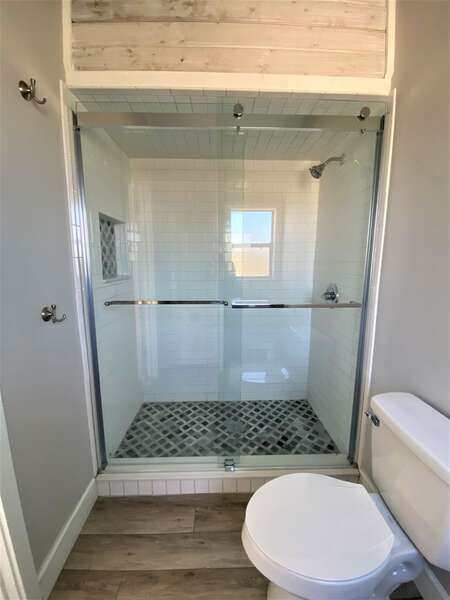 Sliding door, walk-in shower with tile floor