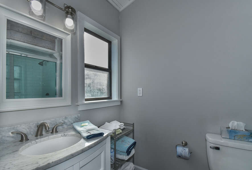 Bathroom with gray marbled countertop