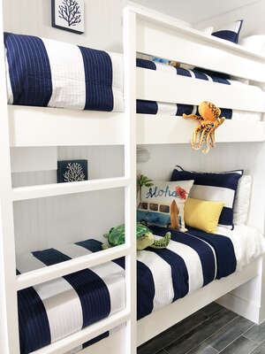 Super fun kid's bunks in hallway!! These are narrow, so ideal for kids! Built in TV on the opposite side! Kids LOVE these bunks and sea creatures!!