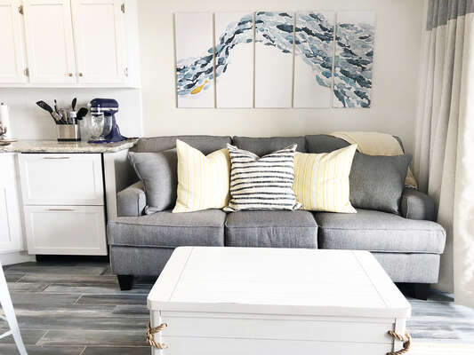 A super comfy sleeper sofa in the family room with a memory foam topper!