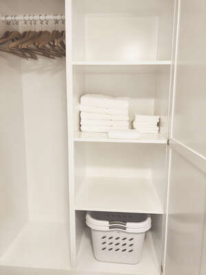 Custom closet space in bedroom. Laundry baskets provided for the coin laundry facilities on site. Lobby can make change for you!