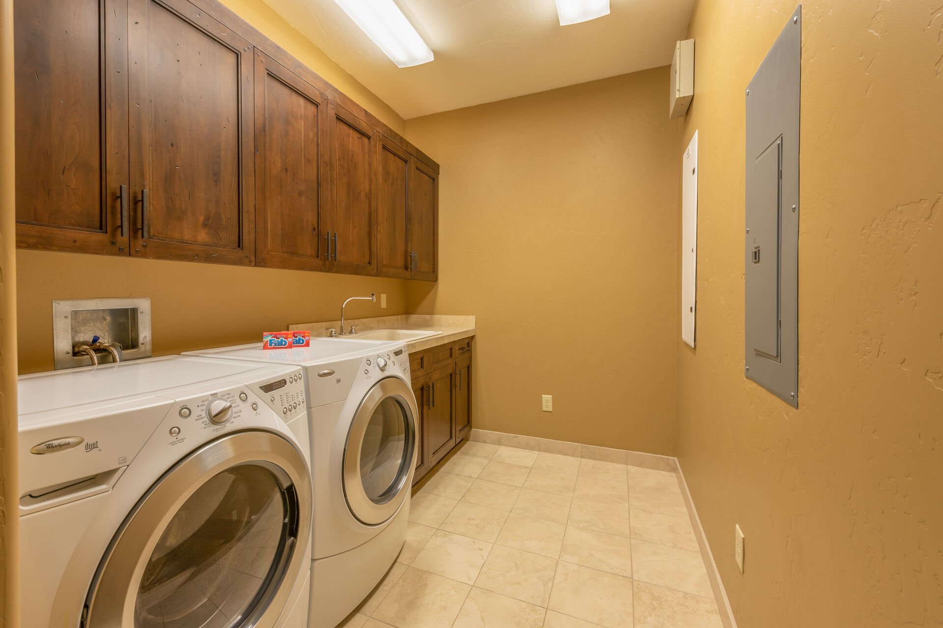 1st Level Laundry Room with Full Size Front Load Washer and Dryer