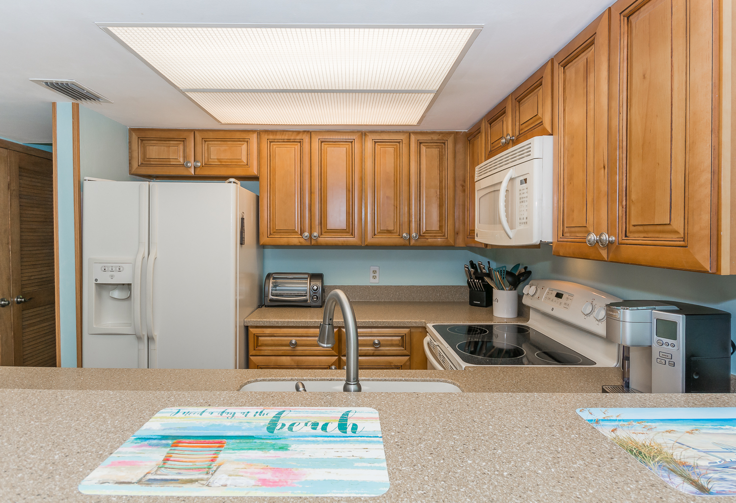 The fully equipped kitchen features GE appliances and everything you'll need to prepare your families favorite seaside dish.