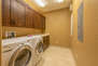 1st Level Laundry Room with Full Size Front Load Washer and Dryer
