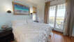 Master Bedroom 1 is an Oceanfront King with Doors out to the Covered Porch & a Private Stone Bath