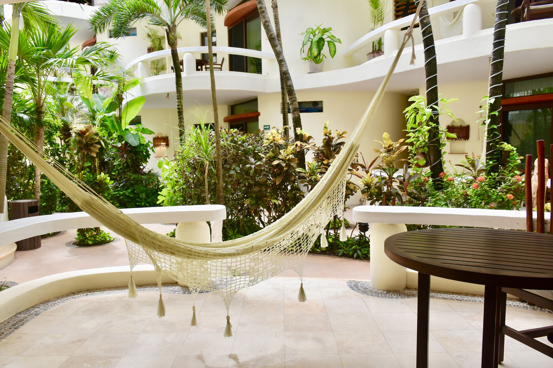 Large balcony with chairs and hammock.
