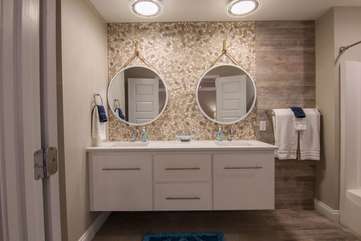 Another view of this marvelous stone wall backdrop with dual sinks