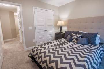 This dark, but light diverse guest bedroom is located in the 3rd bedroom upstairs