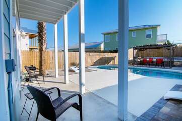 Back yard pool view with privacy fence