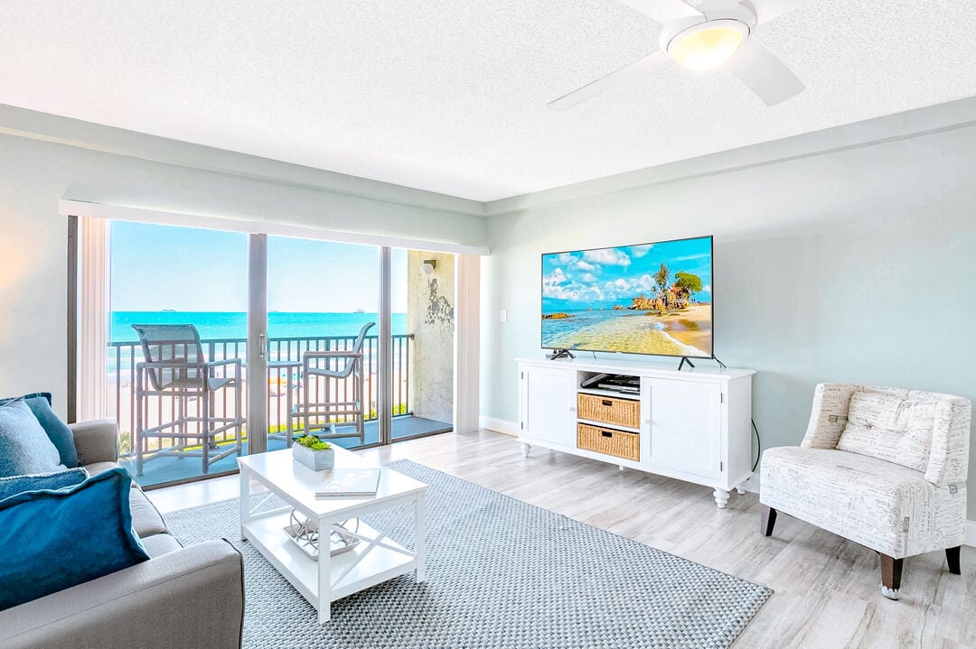 Bright and airy living space with stunning ocean views and cozy seating