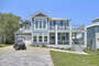 Front drive of this Destin vacation home, with golf cart.
