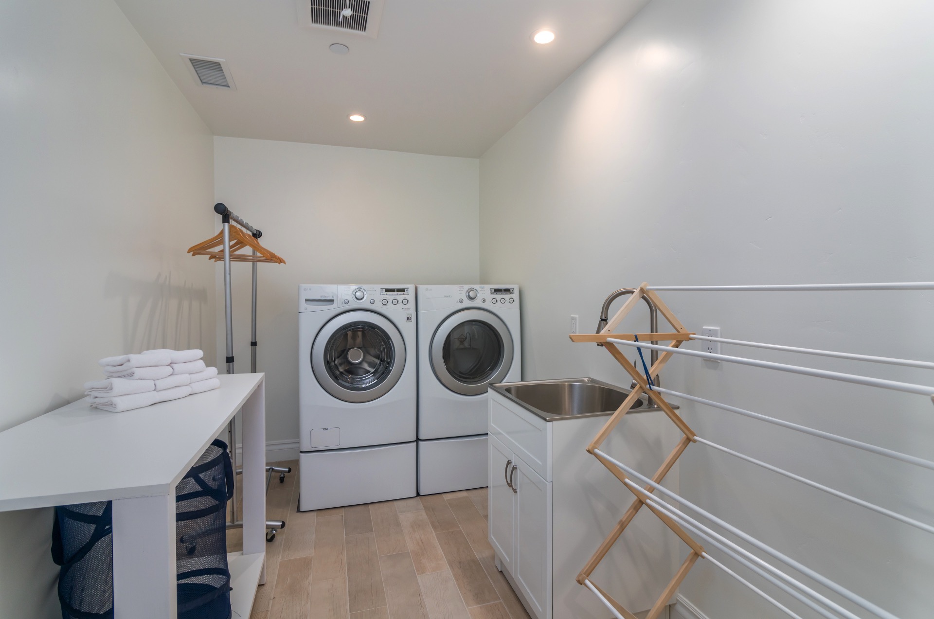 The laundry room is located upstairs by the master bedroom.