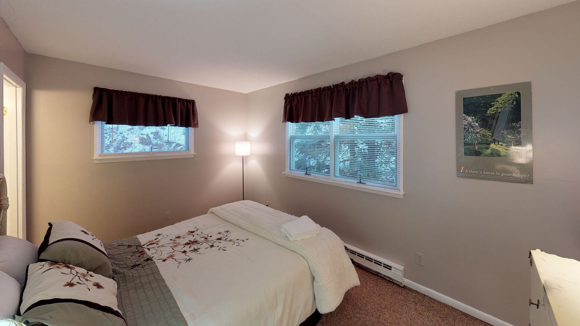 Lower level bedroom room with queen bed and private full bath