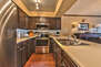 Fully Equipped Kitchen with New Stainless Steel Appliances, including 4-Burner Electric Range