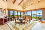 The dining room doors open wide to create a relaxing indoor/outdoor experience.