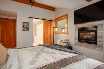Master Bedroom with cozy Gas Burning fireplace and TV