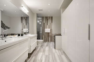 large Ensuite to the Master bedroom with double sinks and storage space