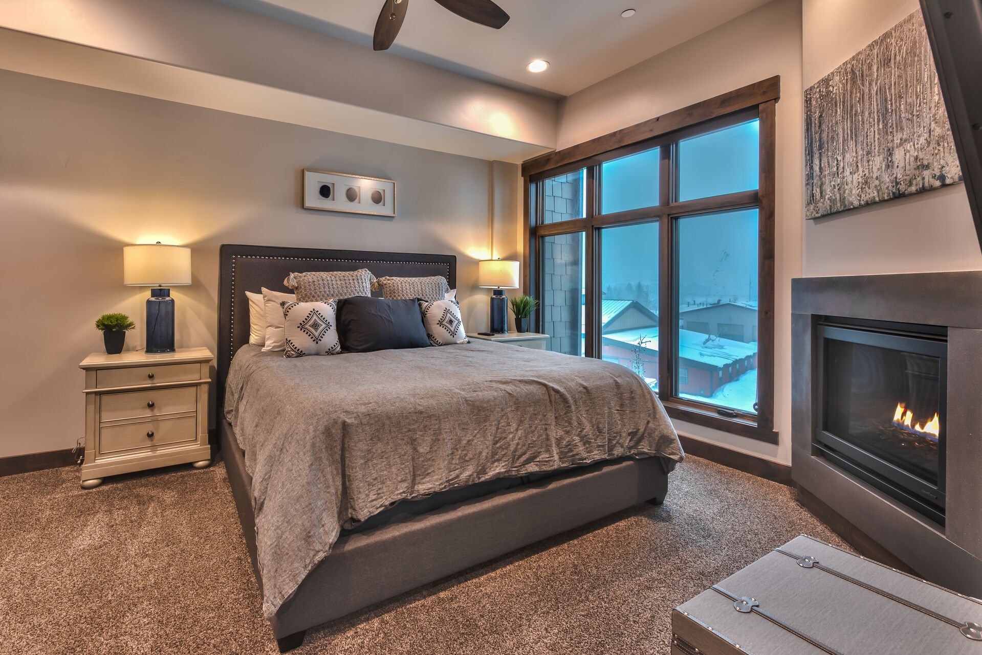 Master Bedroom with a King Bed, a Gas Fireplace, Smart TV and Private Bath