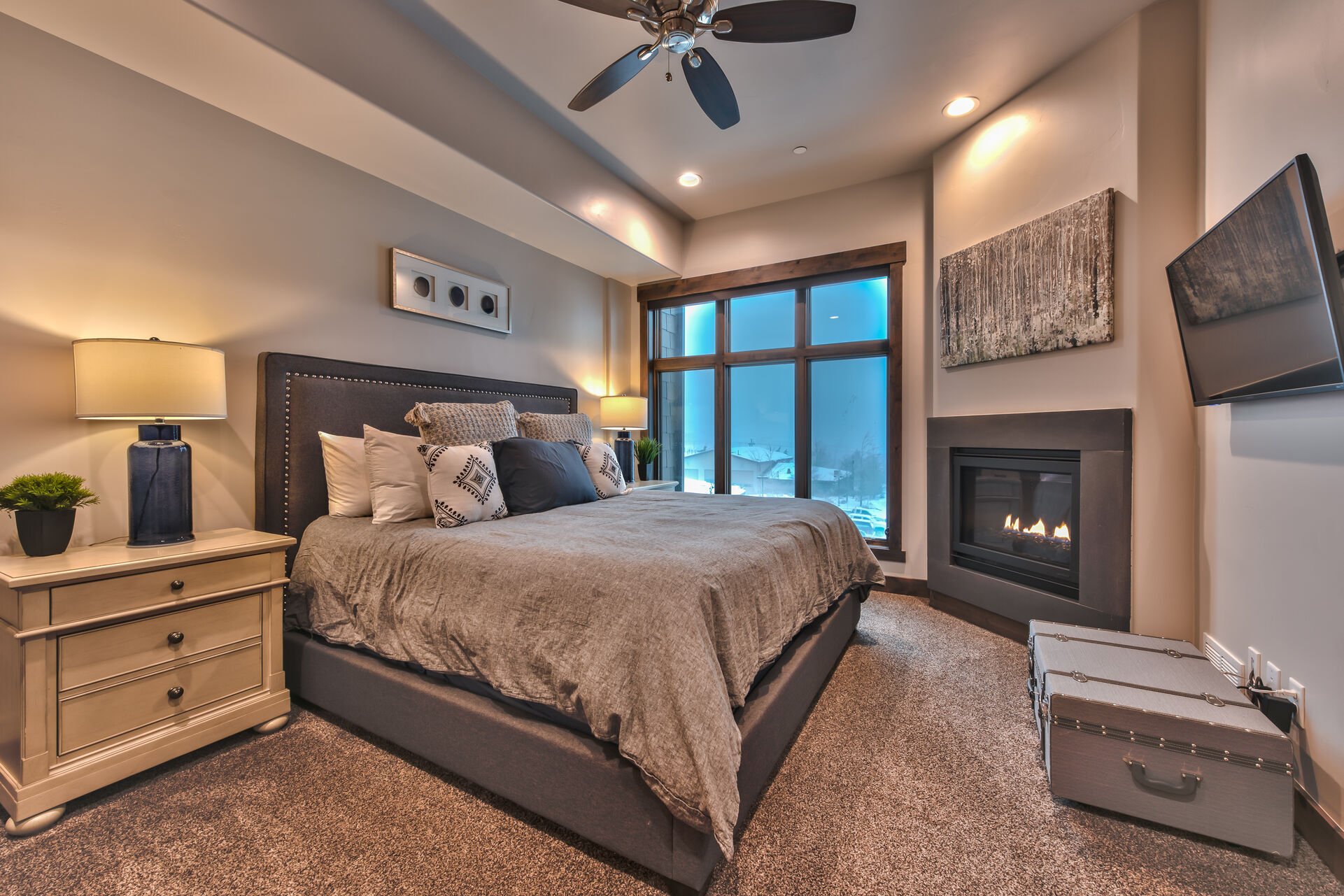 Master Bedroom with a King Bed, a Gas Fireplace, Smart TV and Private Bath